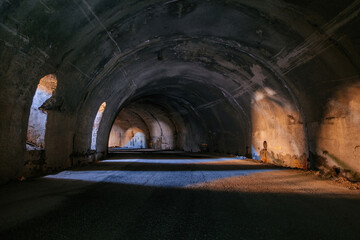 Old underground road tunnel inside mountain