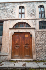 Fototapeta na wymiar Turkish houses wooden door and old windows. Old houses wooden door vintage. safranbolu house