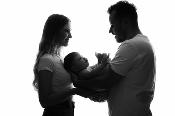 the silhouette of the parents holding the child