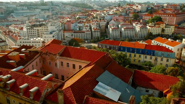 Telephoto shot of the old town of Lisbon, Portugal seen from above, including the famous Martim Moniz square, on a bright sunny day