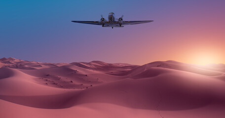Beautiful sand dunes in the Sahara desert - Sahara, Morocco - Vintage type old metallic propeller airplane in the sky
