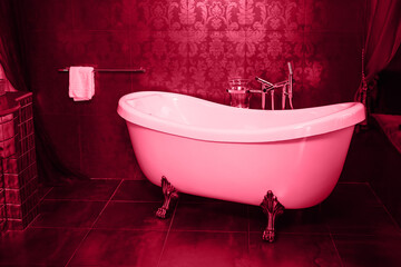Viva Meganta toned red magenta luxury rich shower crane tap faucet bathroom white bathtub with towel clothes dryer. Ceramic home spa design. Trendy color of the year 2023. Fashion color pattern
