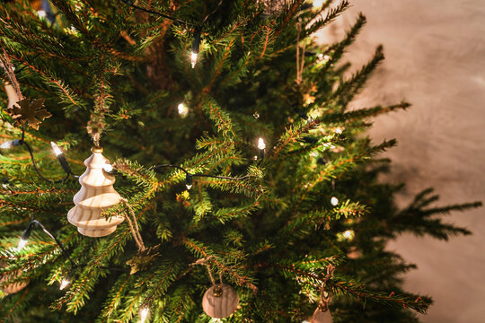 Close-up of christmas tree with decorations and fairy lights
