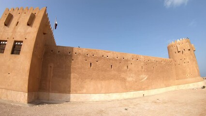 Travel in North of Qatar at Al Zubara Fort. Entrance of old castle, a historic military fortress in Middle East, Arabian Peninsula, desert landscape of Persian Gulf.