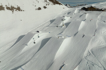 Aerial drone view of Madonna di Campiglio Trentino and ursus snowpark in Val Rendena dolomites...