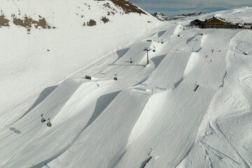 Aerial drone view of Madonna di Campiglio Trentino and ursus snowpark in Val Rendena dolomites Italy in winter