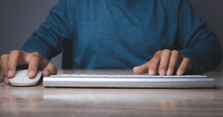 Man hand working at office table of keyboard computer.
