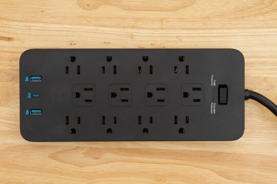 Surge protector with USB protection on wood desk