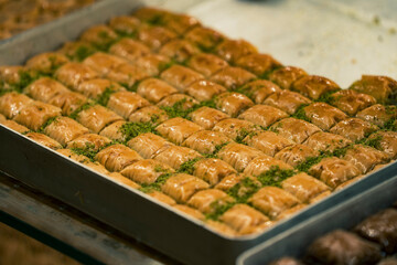Traditional Turkish dessert baklawa in different flavors and styles in the Egyptian bazaar in...