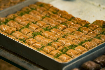 Traditional Turkish dessert baklawa in different flavors and styles in the Egyptian bazaar in Istanbul. Dessert shop at grand bazar baklava ramadan