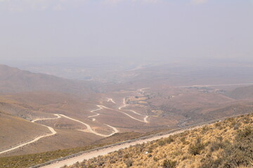  Dirt road lost between mountains. Streets of Purmamarca, Jujuy, Argentina. Mountains of incredible...