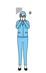 落ち込んで顔を覆う作業着を着たシニア女性（経営者、管理職、工場長）