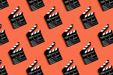 clapper board for shooting video and movies pattern on orange background