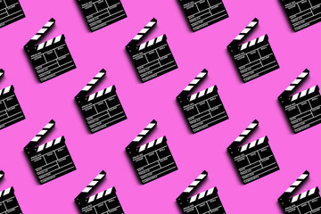 clapper board for shooting video and movies pattern on pink background