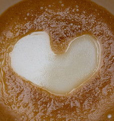 Amazing a heart shape formed on the bottom of my Piccolo Latte. After completing my coffee a love heart appeared in the bottom of the cup its truly freakish  