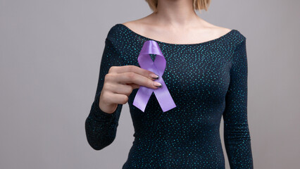 Woman holding a purple ribbon in her hands ADD,ADHD,Alzheimer Disease ,Arnold Chiari Malformation,Childhood Hemiplegia stroke, Epilepsy, Chronic Acute Pain,Crohns