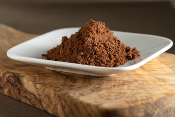 Cacao. Pile of cocoa powder in plate