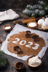 Gingerbread dough for cookies in shape of 2023