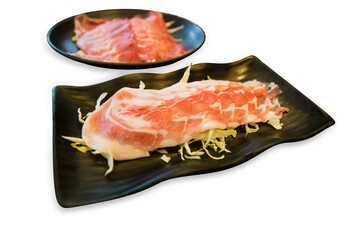 Top view of Sliced Beef with Shredded cabbage in the black plate, focus selective