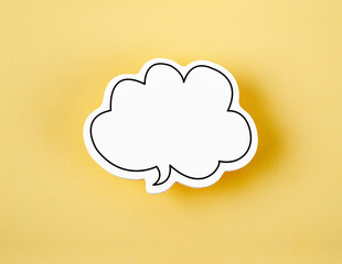A Speech bubble with copy space communication talking speaking concepts on yellow background.
