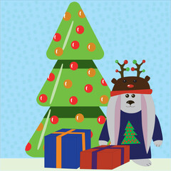 Little rabbit in Santa's reindeer hat near the Christmas tree
