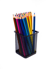 multi-colored felt-tip pens in a glass on a white background, close-up, copy space, contemporary art. Modern design
