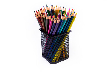 multi-colored felt-tip pens in a glass on a white background, close-up, copy space, contemporary art. Modern design