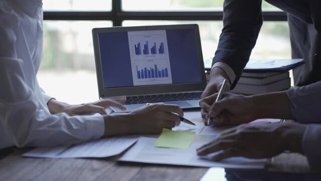 Business team meeting to analyze and discuss the financial report situation in conference room investment advisor Finance, accounting concept. 4k video.
