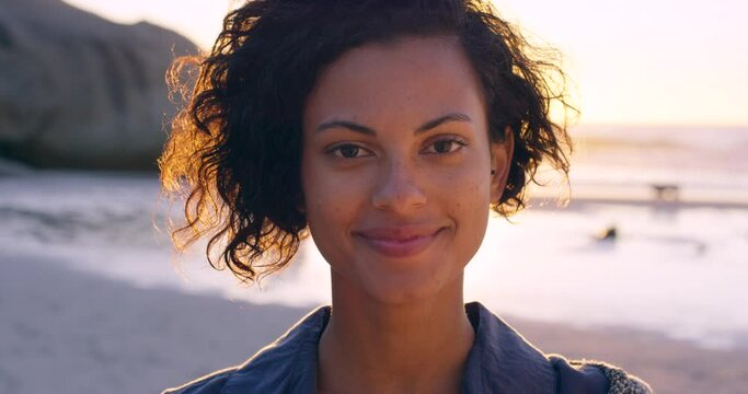 Happy, beach and woman face outdoor on holiday travel ready for ocean walking and sunset. Black woman from Brazil portrait feeling vacation freedom with happiness in nature by sea with free feeling