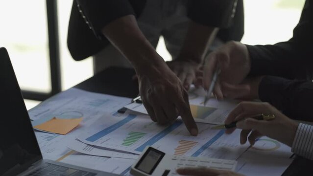 Business team meeting to analyze and discuss the financial report situation in conference room investment advisor Finance, accounting concept. 4k video.