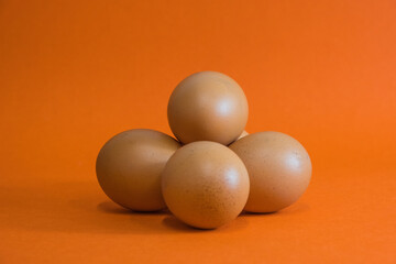 Brown Chicken eggs in carton box on Black background, Eggs with carton box in the background on black