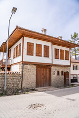 Fototapeta na wymiar Traditional Ottoman house in Safranbolu. Safranbolu UNESCO World Heritage Site. Old wooden mansion turkish architecture. Wooden ottoman mansion