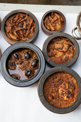 traditional turkish food in pottery. pottery kebabs on white background top view