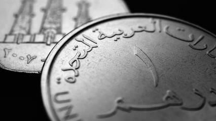 Translation: 1 one dirham United Arab Emirates. UAE coin close-up. National currency of  Emirates....