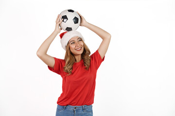 Happy asian woman in santa hat and red t-shirt isolated on white background. Celebrate World Cup victory, soccer fans concept.