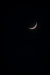 Crescent moon on a moonless night