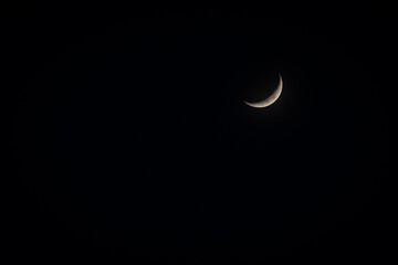 Obraz na płótnie Canvas Crescent moon on a moonless night