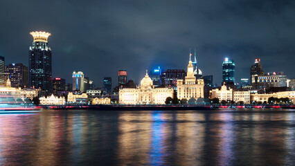 night view of shanghai bund historical landmark buildings along Huangpu river.
