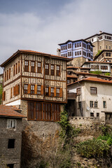 Fototapeta na wymiar Traditional Ottoman Houses in Safranbolu. Ottoman houses. Safranbolu UNESCO World Heritage Site. Old wooden mansions turkish architecture. Safranbolu landscape view.
