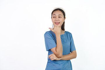 Beautiful Asian woman in blue t-shirt isolated on white background. Hands pointing for advertise or discount