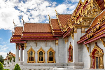 Wat Benchamabophit Dusit Wanaram (This temple is known as the Marble Temple) in Bangkok, blue sky and clouds. One of the most beautiful temples in Thailand Favorite destination in Bangkok. Daytime.