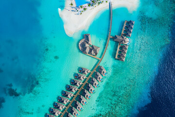 Maldives paradise island. Tropical aerial landscape, seascape water bungalows villas private pools with amazing sea lagoon beach. Exotic tourism destination, summer vacation background. Aerial travel