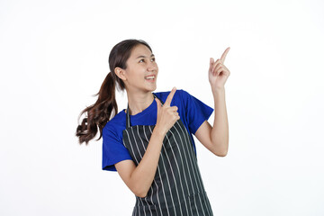 Excited asian coffee shop SME owner asian woman wearing blue t-shirt and black apron isolated on white background. Hands pointing