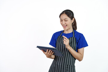 Excited asian coffee shop SME owner asian woman wearing blue t-shirt and black apron isolated on white background. Holding and using tablet