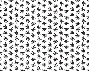 Black tracks of lizards on a white background, seamless pattern 