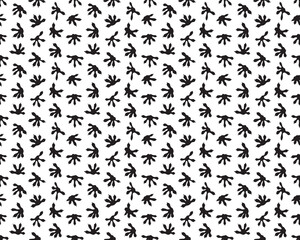 Black tracks of lizards on a white background, seamless pattern 