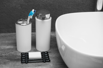 White Soap bar on soap dish and cotton towels on counter table in the bathroom