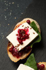Sandwiches with cheese, lingonberry jam and flax seeds