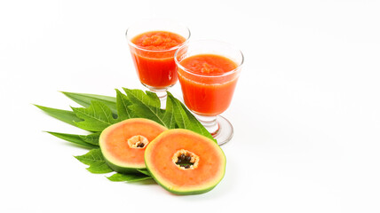 Papaya smoothie in glass jar and glasses on white background diet vegetarian healthy and freshness drink concept soft and selective focus