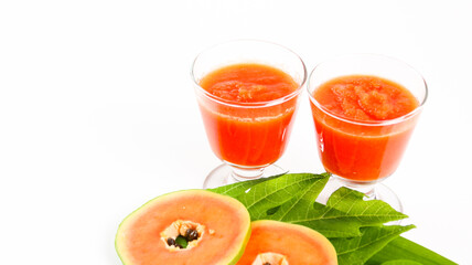 Papaya smoothie in glass jar and glasses on white background diet vegetarian healthy and freshness drink concept soft and selective focus